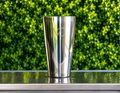 The Magic Shaker 2.0 — mirror-polished stainless steel shaker with the MC mark